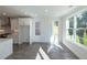 Bright dining area featuring hardwood floors, white walls, and natural light from large windows at 2270 Siskin Square Rd # 91, Duluth, GA 30096