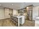 Open kitchen with a large island, stainless steel appliances, and hardwood floors at 2270 Siskin Square Rd # 91, Duluth, GA 30096