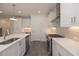 Modern kitchen with white cabinetry, stone countertops, stainless steel appliances, and tiled backsplash at 2270 Siskin Square Rd # 91, Duluth, GA 30096