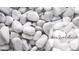 Close-up of warm stone collection showcasing smooth, round, white pebbles and elegant lettering at 2270 Siskin Square Rd # 91, Duluth, GA 30096