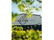Noona sign seen through leaves and lights hanging outside a restaurant at 2270 Siskin Square Rd # 91, Duluth, GA 30096