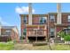Close up of a backyard with a wooden deck and brick townhome exterior, perfect for relaxing outdoors at 2755 Greenbridge Dr, Norcross, GA 30071