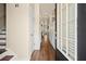 Inviting foyer features hardwood floors, wainscoting, and a door with glass panes letting in natural light at 2755 Greenbridge Dr, Norcross, GA 30071