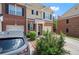 Attractive brick townhouse with a neatly landscaped front yard and attached garage at 2755 Greenbridge Dr, Norcross, GA 30071
