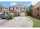 Charming townhouse featuring brick facade, attached garage, and well-maintained landscaping at 2755 Greenbridge Dr, Norcross, GA 30071