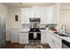 The kitchen features white cabinets, stainless steel appliances, and a subway tile backsplash at 2755 Greenbridge Dr, Norcross, GA 30071
