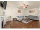 Comfortable living room featuring a gray sectional sofa, wood floors, and a ceiling fan at 2755 Greenbridge Dr, Norcross, GA 30071