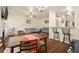 Open-concept living space featuring a gray sofa, wood floors, and a dining area at 2755 Greenbridge Dr, Norcross, GA 30071