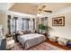 Bright bedroom with a sitting area, large windows, and an overhead fan at 5917 Southland Dr, Stone Mountain, GA 30087