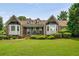 Charming brick home with manicured lawn and lush landscaping creating wonderful curb appeal at 5917 Southland Dr, Stone Mountain, GA 30087