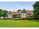 Charming brick home with manicured lawn and lush landscaping creating wonderful curb appeal at 5917 Southland Dr, Stone Mountain, GA 30087