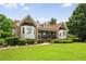 Charming brick home with manicured lawn and lush landscaping creating wonderful curb appeal at 5917 Southland Dr, Stone Mountain, GA 30087