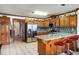Updated kitchen with granite counters, stainless steel appliances and breakfast bar at 5917 Southland Dr, Stone Mountain, GA 30087