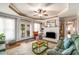 Cozy living room features a fireplace, trey ceiling, bright windows, and access to the backyard at 5917 Southland Dr, Stone Mountain, GA 30087