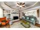 Cozy living room features a fireplace, trey ceiling, built-in shelving, and comfortable seating at 5917 Southland Dr, Stone Mountain, GA 30087