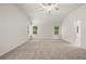 Spacious main bedroom with vaulted ceiling, plush carpet, and lots of natural light at 9457 Briarwood Ln, Jonesboro, GA 30238