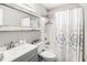 Clean bathroom features a shower-tub combo, white tile, and modern vanity at 1150 Bonita Cir, Jonesboro, GA 30238