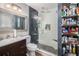 Modern bathroom featuring a glass-enclosed shower, sleek fixtures, and ample storage at 1150 Bonita Cir, Jonesboro, GA 30238