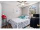 Bright bedroom featuring light walls, wood-look flooring, and a ceiling fan at 1150 Bonita Cir, Jonesboro, GA 30238