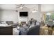 Inviting living room showcasing a fireplace, TV, and open layout to the kitchen and dining area at 1150 Bonita Cir, Jonesboro, GA 30238