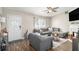 Cozy living room featuring a decorative fireplace, ceiling fan and comfortable seating at 1150 Bonita Cir, Jonesboro, GA 30238