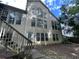 View of the home's back exterior showing multiple windows at 1167 Drewsbury Ct, Smyrna, GA 30080