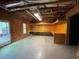 Unfinished basement with workspace and door to the outdoors at 1167 Drewsbury Ct, Smyrna, GA 30080