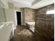 Bathroom showcasing dual sinks, stone accent wall, and tiled flooring at 1167 Drewsbury Ct, Smyrna, GA 30080
