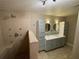 Modern bathroom featuring a large walk-in shower with multi shower heads and a double sink vanity at 1167 Drewsbury Ct, Smyrna, GA 30080