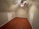 This bedroom features a ceiling fan, wood floors and two doors with access to other spaces at 1167 Drewsbury Ct, Smyrna, GA 30080