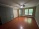 Spacious bedroom featuring carpet floors, ceiling fan, closet and windows with lots of natural light at 1167 Drewsbury Ct, Smyrna, GA 30080