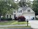 Charming two-story home with manicured lawn, arched windows and shutters, and a two-car garage at 1167 Drewsbury Ct, Smyrna, GA 30080