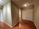 Neutral hallway with wood flooring and closet for storage space at 1167 Drewsbury Ct, Smyrna, GA 30080
