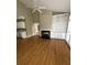 Bright living room with a fireplace, wooden floors, and built-in shelving at 1167 Drewsbury Ct, Smyrna, GA 30080