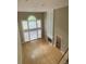 Spacious living room with hardwood floors, fireplace, built-ins, and soaring windows at 1167 Drewsbury Ct, Smyrna, GA 30080