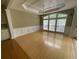 Spacious living room with hardwood floors, large windows, tray ceiling, and elegant trim at 1167 Drewsbury Ct, Smyrna, GA 30080