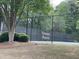 Tennis courts behind a black fence at 1167 Drewsbury Ct, Smyrna, GA 30080