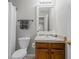 Bathroom featuring a single sink vanity with wood cabinets and shower with curtain at 1439 Alice Ave, Lithonia, GA 30058