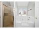 Bright bathroom features a soaking tub and separate shower at 1439 Alice Ave, Lithonia, GA 30058