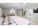 Large bedroom with sitting area and bright natural light at 1439 Alice Ave, Lithonia, GA 30058