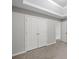 Bedroom featuring double closets and a neutral color scheme with carpeted floor at 1439 Alice Ave, Lithonia, GA 30058