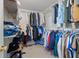 Walk-in closet with clothing racks and ample storage space at 1439 Alice Ave, Lithonia, GA 30058