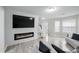 Open floor plan with a fireplace and lots of natural light at 1439 Alice Ave, Lithonia, GA 30058