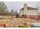 Back patio with built-in barbeque and stone tile at 1439 Alice Ave, Lithonia, GA 30058