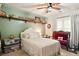 Comfortable bedroom with shelving, carpet, a full-sized bed, and large windows at 1825 Crescent Rdg, Cumming, GA 30041