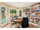 Bright breakfast nook with large windows, wood floors and built in pantry at 1825 Crescent Rdg, Cumming, GA 30041
