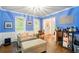 Bright blue living room with white trim and a view of the front door at 1825 Crescent Rdg, Cumming, GA 30041