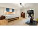 Spacious main bedroom with carpet and ceiling fan at 1825 Crescent Rdg, Cumming, GA 30041