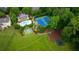 Expansive backyard featuring a pool, tennis court, basketball court, and playground surrounded by lush greenery at 8109 Lawnview, Alpharetta, GA 30022