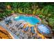 Stunning pool area with a spa, stone patio, and lush landscaping at 8109 Lawnview, Alpharetta, GA 30022